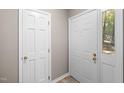 The entryway shows white doors and a glimpse of the outside through the window at 502 Forest Court, Carrboro, NC 27510
