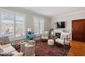 Inviting living room featuring hardwood floors, plantation shutters, and stylish decor at 605 Smedes Pl # B, Raleigh, NC 27605