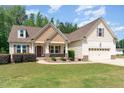 Attractive two-story home with a well-maintained lawn and inviting front porch at 70 Breadnut Dr, Smithfield, NC 27577