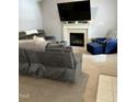Comfortable living room with a fireplace and plush seating at 128 Madeline Ct, Youngsville, NC 27596