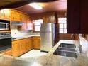 Traditional kitchen features stainless steel appliances and granite countertops at 182 Tree Cutters, Sanford, NC 27332
