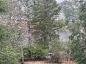 Scenic water view framed by lush trees and foliage, offering tranquility at 182 Tree Cutters, Sanford, NC 27332