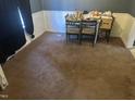 Dining area with carpet, chair railing, and natural light at 2408 Stadium Dr # A, Durham, NC 27704