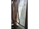 Close-up of a window covered with film and partially obscured by a curtain at 2408 Stadium Dr # A, Durham, NC 27704