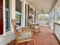 Inviting front porch featuring rocking chairs, a swing, and lovely decor at 321 W Chatham St, Cary, NC 27511