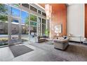 Bright lobby with floor-to-ceiling windows, stylish seating, and elegant wooden wall panels for a modern touch at 400 W North St # 804, Raleigh, NC 27603