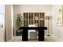 Home office featuring a modern black desk, white chair, and stylish display cabinet, complemented by contemporary decor at 620 Vega Bluff Ln, Angier, NC 27501