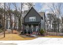 Inviting two-story home features a well-manicured lawn, front porch, and private driveway at 727A Peyton Ave, Durham, NC 27703