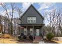 Charming two-story home with inviting front porch and American flag displayed at 727A Peyton Ave, Durham, NC 27703