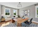 Bright office space featuring a large desk, comfortable seating, hardwood floors, and lots of natural light at 1035 Zelkova Ln, Chapel Hill, NC 27517