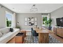 A stylish and modern office space with ample natural light, a spacious desk, and comfortable seating at 1035 Zelkova Ln, Chapel Hill, NC 27517