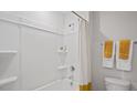 Clean bathroom with a white tub and shower combination and a simple shower curtain at 106 Craig Point Dr, Clayton, NC 27520