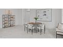Cozy dining area featuring a modern table, stylish chairs, and contemporary decor for elegant meals at 116 Pointe Park Cir, Holly Springs, NC 27540