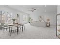 Spacious living area includes a dining table with chairs and a seating area for versatile entertaining and relaxation at 116 Pointe Park Cir, Holly Springs, NC 27540
