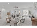 Bright living room featuring neutral tones, modern furniture, and stylish decor creating an inviting atmosphere at 116 Pointe Park Cir, Holly Springs, NC 27540