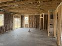 Unfinished interior showcasing exposed beams and framing, offering a glimpse into the construction and potential layout at 164 Jones Creek Ln, Lillington, NC 27546