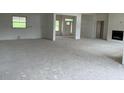 Bright living room featuring large windows and a cozy fireplace at 187 Dairymont Dr, Pittsboro, NC 27312