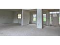Spacious living room area with large windows offering natural light at 187 Dairymont Dr, Pittsboro, NC 27312