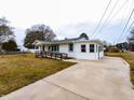 Well-maintained home featuring a convenient driveway and a welcoming, accessible ramp at 200 Pace St, Smithfield, NC 27577
