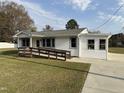 Charming single-story home featuring a wooden ramp and freshly cut green lawn at 200 Pace St, Smithfield, NC 27577