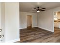 Inviting living room featuring stylish flooring, ample natural light, and a ceiling fan at 200 Pace St, Smithfield, NC 27577