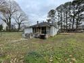 View of the backyard highlighting the outdoor space and the home's exterior at 200 Rand Mill Rd, Garner, NC 27529