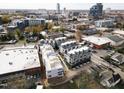 Aerial view of newly constructed modern townhomes, showcasing the community layout and surrounding cityscape at 2000 Moody Ln, Durham, NC 27701