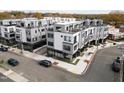 Modern townhome exterior featuring clean lines, large windows, and rooftop terraces in an urban setting at 2000 Moody Ln, Durham, NC 27701