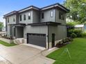 Contemporary home showcasing a spacious driveway leading to a two-car garage with clean lines and modern design at 2305 Turners Aly, Raleigh, NC 27607