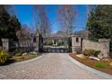 Brick entrance gate leading to a stunning home, providing privacy and security at 2421 Acanthus Dr, Wake Forest, NC 27587
