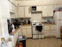 Picture of the kitchen with white appliances, cabinets and floor at 322 Junction Rd # 17D, Durham, NC 27703
