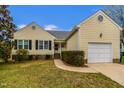 Charming single-Gathering home with attached garage, manicured lawn, and traditional architecture at 4212 Birmingham Way, Raleigh, NC 27604