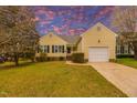 Charming single-Gathering home with attached garage, manicured lawn, and traditional architecture at 4212 Birmingham Way, Raleigh, NC 27604