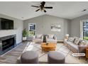 Cozy living room featuring a fireplace, vaulted ceilings, and ample natural light at 4804 Red Coat Ct, Raleigh, NC 27616