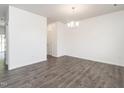 Spacious living room with modern laminate flooring and abundant natural light, ready for entertaining at 516 Spaulding St, Burlington, NC 27215