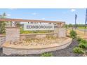 Welcome to Edinborough, featuring a stone entrance and lush landscaping at 519 Fife Ct, Gibsonville, NC 27249