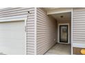 Close up of home's entrance showing attached garage and front door entryway at 629 Kenyon Spring Dr, Zebulon, NC 27597