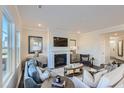 Cozy living room featuring a fireplace, comfortable seating, and stylish decor for relaxation and entertainment at 760 Swim Cave Ln, Wendell, NC 27591