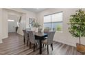 Dining room with gray chairs, wooden table, large window, and modern decor at 917 Matterhorn Dr, Fuquay Varina, NC 27526