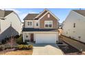 Charming two-story home with a two-car garage, well-kept lawn, and a cozy covered entryway at 917 Matterhorn Dr, Fuquay Varina, NC 27526