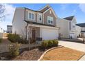 Well-maintained home featuring a two-car garage, tidy landscaping, and neutral-colored siding at 917 Matterhorn Dr, Fuquay Varina, NC 27526