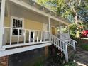 View of house with steps to a covered porch at 116 Dunstan Ave, Durham, NC 27707