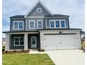 Two-story home boasts gray siding, stone accents, and a two-car garage, with a well-manicured lawn at 130 W Crescent Mills Blvd # Homesite 251, Wilson's Mills, NC 27520