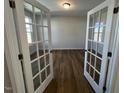 Study or office space with French doors and wood laminate flooring at 173 Wild Turkey Way, Lillington, NC 27546