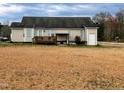 Expansive backyard with a wooden deck, covered area, offering ample space for outdoor activities at 1925 Eagle View Drive Dr, Wendell, NC 27591