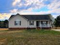 Inviting single-story home with a well-maintained lawn, classic curb appeal and covered entry at 1925 Eagle View Drive Dr, Wendell, NC 27591