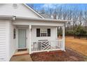 Inviting front porch with a bench, providing a welcoming entrance to the home at 201 Moss Creek Dr, Clayton, NC 27520
