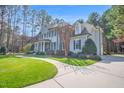 Spacious home with well-maintained lawn and a long driveway at 204 Dartmoor Ln, Raleigh, NC 27614