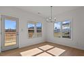 Bright dining area with hardwood floors and view to outdoors at 336 Pecan Valley Way, Four Oaks, NC 27524