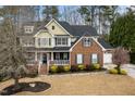 Beautiful two-story home with a covered porch, attached garage, and manicured landscaping at 3659 Coach Lantern Ave, Wake Forest, NC 27587